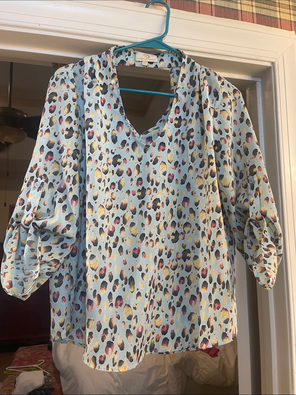 Collective Concepts Light Blue V-Neck Blouse with Multicolor Leopard Spots